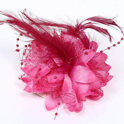 Di Bartelomeo Bloem met parels en veertjes roze